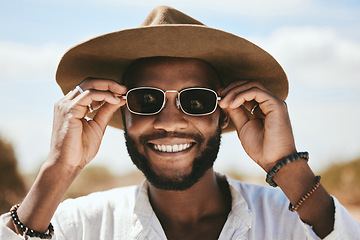 Image showing Vision, style or fashion sunglasses for black man with designer, trend or cool optometry eye care. Zoom, smile or happy face of tourist, model or student on safari travel in Kenya nature environment