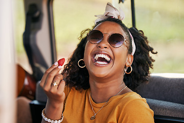 Image showing Happy, road trip and black woman eating a strawberry in a car on a travel holiday in nature. Portrait of a young, funny and African girl with fruit in a van on vacation for adventure and freedom