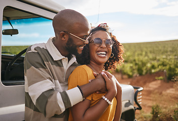 Image showing Travel, love and black couple on a road trip in nature on a happy summer holiday or vacation outdoors. Smile, happiness and fun woman hugging, bonding and relaxing with partner on a romantic journey
