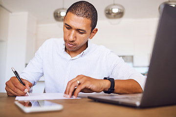 Image showing Man, paper and desk writing in planning, accounting or signing contract in home. Notebook, businessman and with a report, budget or finance on laptop, phone and page for business, goal or strategy