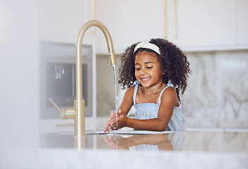 Image showing Little girl, washing and hands with smile in the kitchen for healthy clean hygiene at home. Happy black female child rinsing and cleaning hand by the sink at the house after a day outside