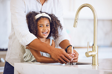 Image showing Portrait of a family washing their hands for hygiene, to stop germs and health in the kitchen at home. Happy, smile and father helping his child clean her hand of bacteria, dirt and dust in a house.