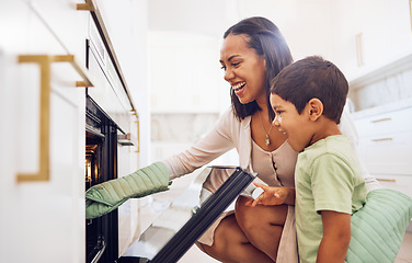 Image showing Mother, child and baking in oven learning to make biscuits, cookies or cake in home kitchen. Care, support or love of happy parent bonding, cooking or teaching boy to bake dessert on stove together