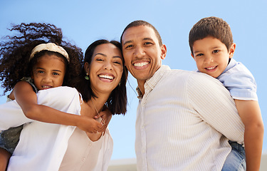 Image showing Family, children and piggyback outside with a girl and boy on the back of their mother and father while outdoor in nature. Kids, together and love with parents carrying a brother and sister outside