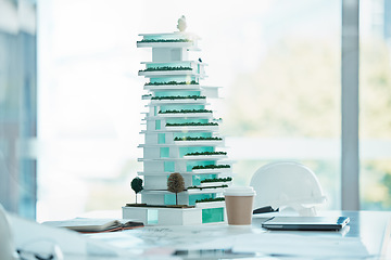 Image showing Architecture, model and mockup design of a 3d miniature future building on a table in office. Engineering, planning and mini apartment construction structure for architectural or industrial project.
