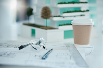 Image showing Architecture, planning and design on desk with drawing tools, safety glasses and coffee. Blueprint, vision and idea for architect, engineer or construction worker in building or construction industry