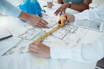 Image showing Architecture hands, blueprint design and tape measure for construction scale, property planning and building logistics. Industrial engineering designers, ruler size floor plan and real estate project