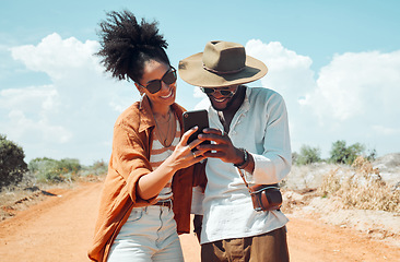 Image showing Black couple with phone, travel and adventure, happy outdoors in outback Australia during summer vacation. Romantic, bonding roadtrip and smile, search for map on mobile app or internet.