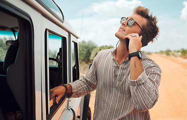 Image showing Phone, road trip and vehicle breakdown with a man on a call for roadside assistance while on holiday or vacation in the desert. Transport, stranded and alone with a young male calling for help