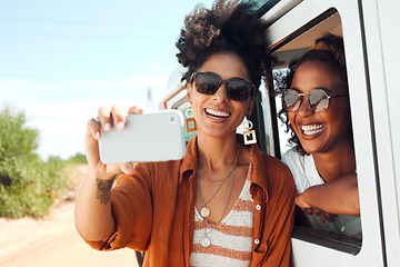 Image showing Selfie, smile and friends on a road trip with a car during a safari holiday in Kenya. African women with phone for photo, communication and social media live streaming on vacation in the desert