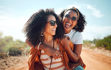 Image showing Black women, friends and nature holiday portrait, vacation or summer trip. Safari, sunglasses and girls piggy back, spending time together bonding and having fun in countryside, outdoors or desert.