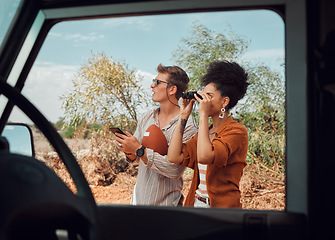 Image showing Nature, safari and a couple with binoculars on adventure summer holiday in African game reserve. Love, trees and a man and woman on a bush tour in sunshine, sightseeing and travel in South Africa.