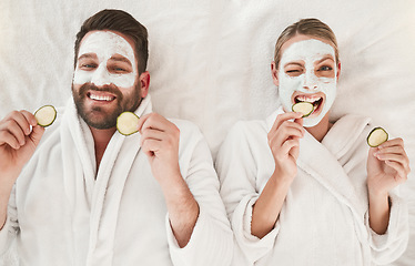 Image showing Couple, facial and relax at spa for wellness, skincare and love together with cucumber. Happy portrait luxury body care or face detox mask in physical therapy for calm and zen beauty or health salon