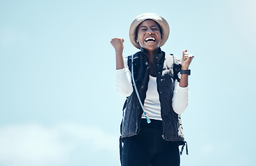 Image showing Winner, happy and black woman celebrate fitness journey out in nature on hike, victory during adventure. Success, blue sky and travel, laugh and freedom, carefree health and active lifestyle.