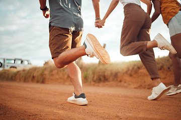 Image showing Running, feet and friends holding hands on holiday in the countryside of Italy together. Legs of group of people playing on a run with support, freedom and adventure on a road trip in nature