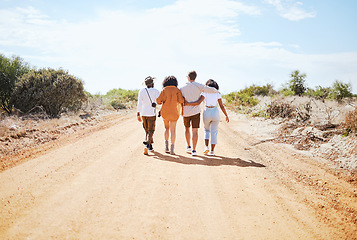 Image showing Friends, hug and travel in the countryside for summer vacation enjoying time together in nature. People in friendship support, care and love hugging on a desert road or safari walking in South Africa