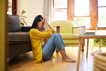 Image showing Stressed woman, depression and lonely in the living room sitting on the floor at home. Young sad female suffering from mental health issues and anxiety or headache in apartment or house