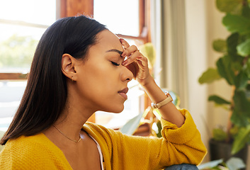 Image showing Stressed woman, headache and burnout with mental health issues at home in the living room. Female in depression alone holding head feeling anxious, depressed and frustrated at the house