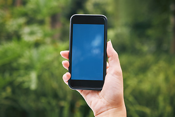 Image showing Digital, mockup and phone with woman in nature for internet, communication and app. Technology, social media and contact with hands of user and smartphone for website, 5g and iot design in outdoor