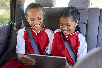 Image showing Children, happy and tablet in car smile, browse online and use social media apps or funny video. Kid friends with digital device or after training, sport or soccer match while playing game online