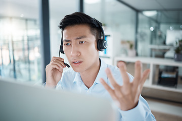 Image showing Stress, confused or computer for call center agent, customer service consultant or crm consulting Vietnamese man in sales deal fail. Contact us receptionist or telemarketing office worker and anxiety