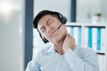 Image showing Man, call center and pain in neck from stress, burnout and tired in customer support, communication and telemarketing. Asian, muscle and hand after hurt from work in crm, support and help in Tokyo