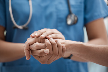 Image showing Hand holding, staff and hospital community with trust, support and hope in a clinic. Healthcare nurse, medical doctor and workers hands together to show work solidarity and team comfort care
