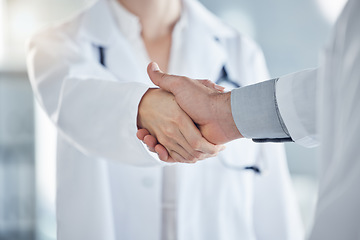 Image showing Handshake, medical and doctors have agreement on patient health, illness treatment plan or diagnosis in clinic. Professional nurse, promotion or solution for virus, medicine or healthcare in hospital