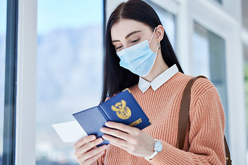 Image showing Passport, id and travel woman with covid face mask for immigration, airport compliance and vacation information security. Covid 19, corona virus and girl with identity document and ticket for flight