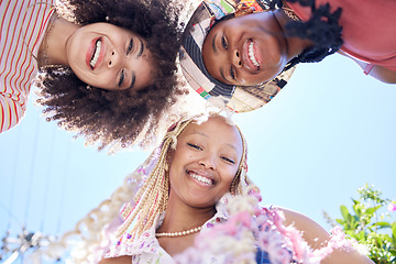 Image showing Happy, smile and gen z friends huddle during holiday in summer in the city of California with blue sky from below. Relax, comic and face portrait of a group of African women on a vacation together