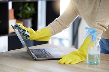 Image showing Laptop, cleaning and hands with an office cleaner wiping a computer on a desk or table with sanitizer. Hygiene, disinfectant and rubber gloves with a woman dusting or washing wireless technology