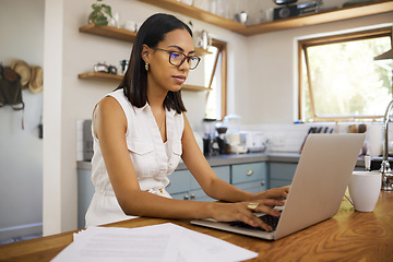 Image showing Woman in business, working on laptop from home and sitting in a kitchen with contract documents on table. Freelance accounting entrepreneur, remote work in house and finance paperwork use 5g internet