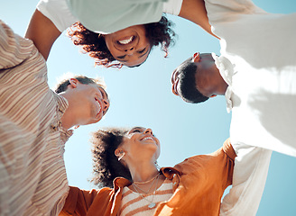 Image showing Huddle, happy and friends with support, love and smile in summer against blue sky. Diversity in group of people in solidarity, trust and happiness with hug, comedy and faith in circle from below