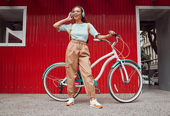 Image showing Student, girl and bike with headphone music for sustainable commute leisure in Chicago, USA. Gen Z college girl with vintage bicycle enjoying eco travel in city with streaming entertainment.