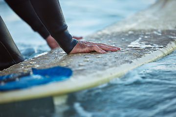 Image showing Surf, ocean surfing and hand of man on surfboard in sea water. Summer water sport fitness, male healthy lifestyle and outdoor wellness exercise and relax beach travel vacation in Hawaii