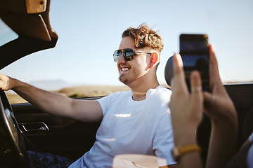 Image showing Couple, phone and road trip of travel vacation in car. Young girl take photograph for social media or memories. Happy man, freedom and enjoy traveling together on holiday....enjoy.friends.happy.smile