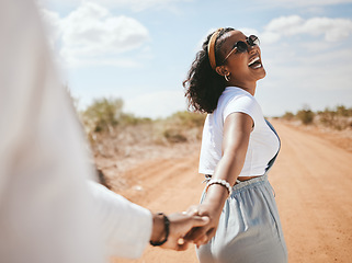 Image showing Happy, safari and couple love holding hands on a romantic honeymoon holiday vacation outdoors in summer. Romance, traveling and black woman with a big smile walking with partner on adventure in Texas