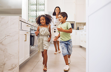 Image showing Mother, kids play together running game and family bonding in kitchen at home. Smiling playful mother, happy excited energetic children and actively enjoying fun leisure indoor activity with mom