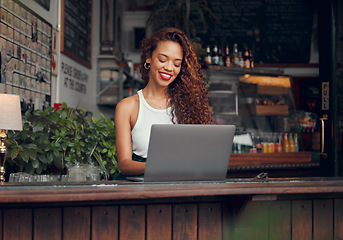 Image showing Remote work, laptop and woman at restaurant typing blog article with satisfied and happy smile. Freelance blogger girl working online and thinking of creative idea at casual cafe in Mexico.