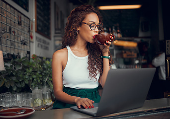 Image showing Coffee, laptop and freelance with a woman entrepreneur doing remote work from an internet cafe. Computer, email and small business with a female working on a report, email or proposal in a restaurant