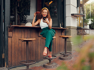 Image showing Happy woman, outdoor cafe and phone of customer on social media, texting or reading message at sidewalk coffee shop. Fashion, internet and 5g communication with a young female drinking coffee outside