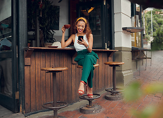 Image showing Phone, social media and coffee with a black woman customer at a cafe counter on the sidewalk. Coffee shop, internet and communication with a young female typing a text message in a restaurant