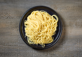 Image showing pasta spaghetti on black plate