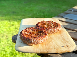 Image showing freshly grilled burgers