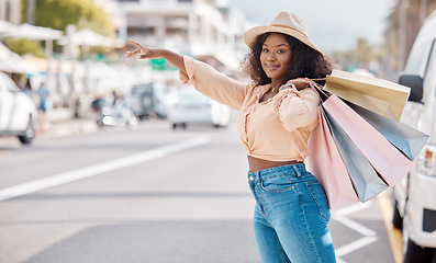 Image showing Retail, shopping and taxi with black woman in city for travel, luxury and fashion in urban street. Happy, sales and gift with customer and discount bag in road to call cab transportation service