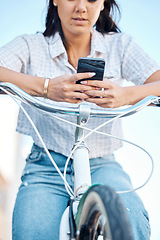 Image showing Hands, phone and woman on bike for city travel, eco friendly and future environment energy transport in Japan. Fashion student, cool model and mobile technology for social media, gps or location map