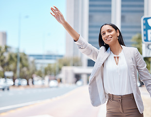 Image showing City, business woman and calling for a taxi in the street to travel or commute to work in the morning. Happy, young and corporate employee doing a arm wave to get a cab or lift in a urban road.