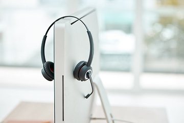 Image showing Headphone, contact us and empty office at call center with computer for online customer service or support. Helpdesk hotline assistance gadgets and crm equipment in workplace or telemarketing office