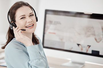 Image showing Call center, customer service and sales woman consulting using a wireless headset in her office. Ecommerce, contact us and crm with a female telemarketing consultant at work for support, help or care