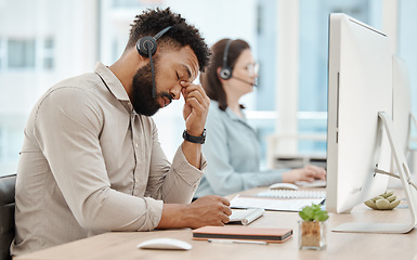 Image showing Stress, headache and call center businessman on computer for customer service or consulting. Support agent, black man and telemarketing virtual advisor tired, frustrated or burnout at work office.
